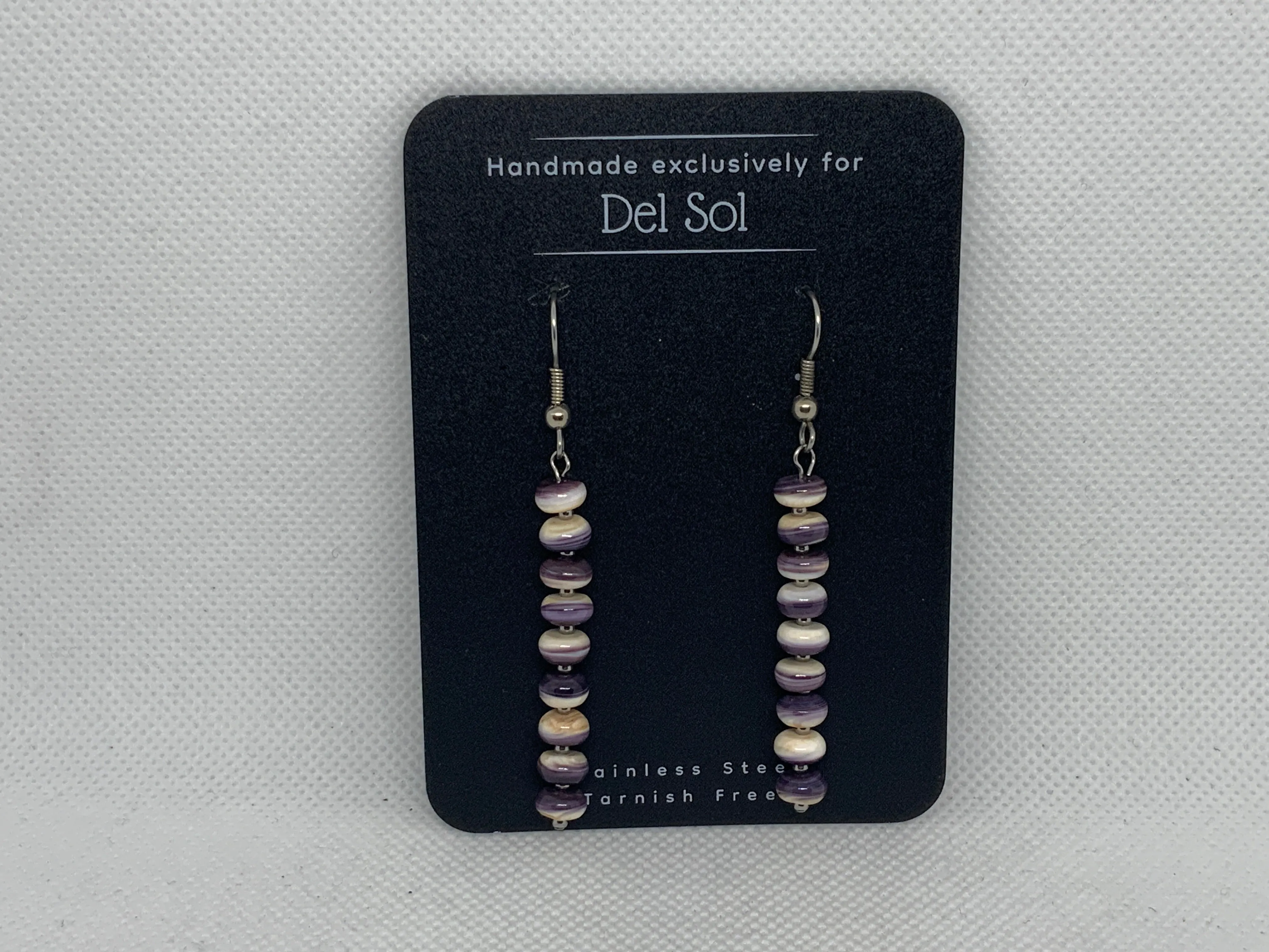 Genuine Quahog (Wampum) shell earrings with hypoallergenic stainless steel beads and ear wires.  EP133