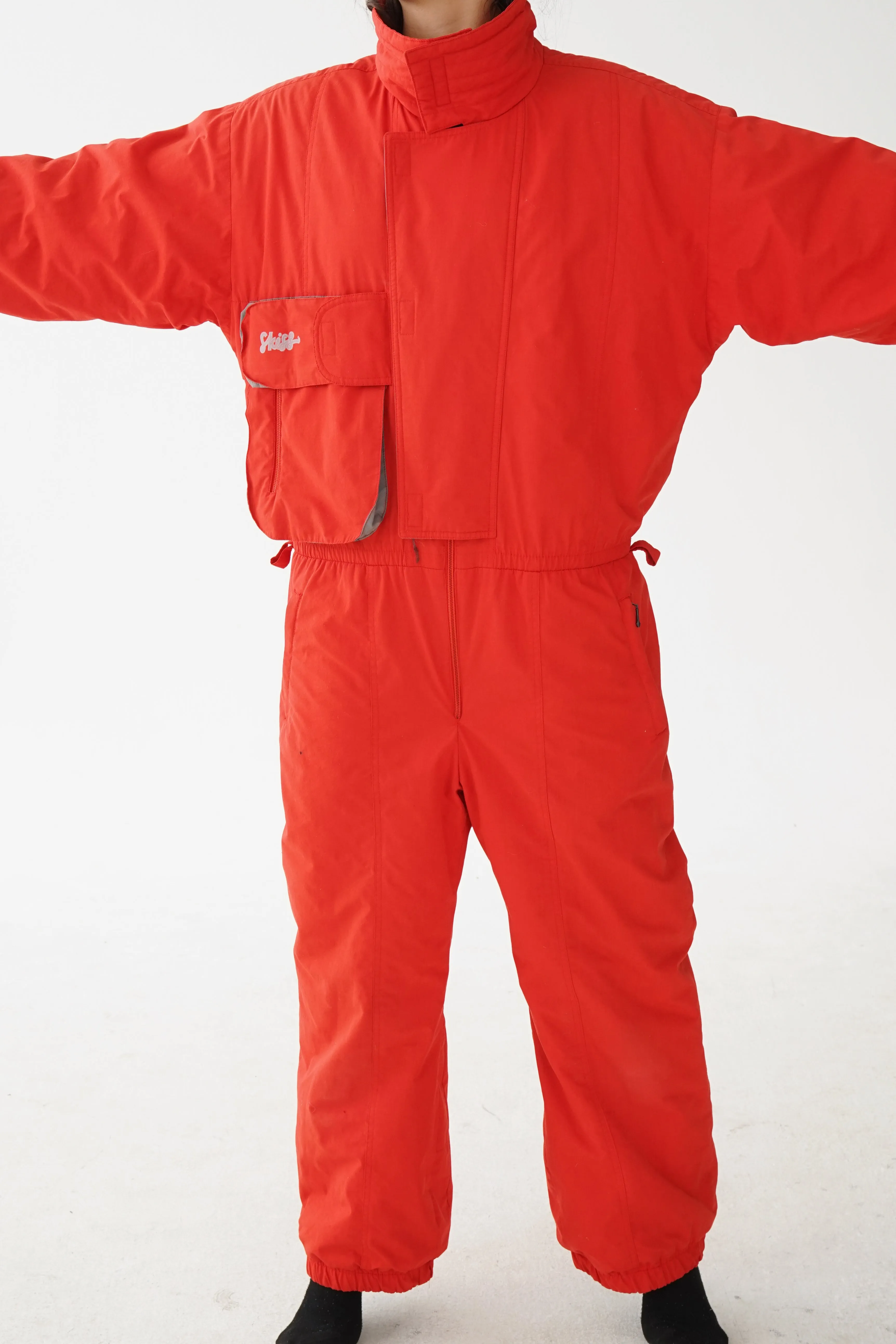 One piece Skiss ski suit, snow suit rouge pour homme taille L-XL