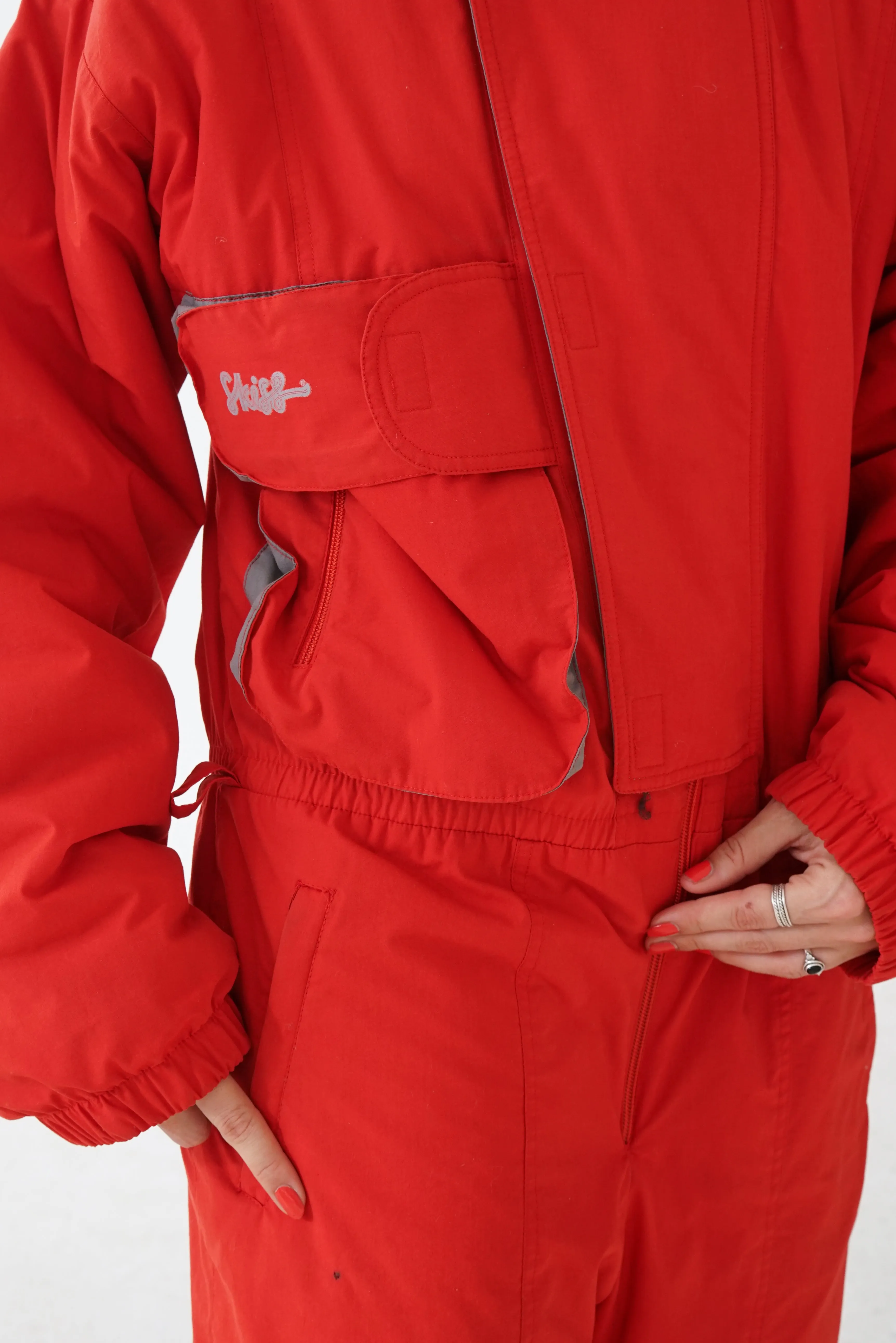 One piece Skiss ski suit, snow suit rouge pour homme taille L-XL